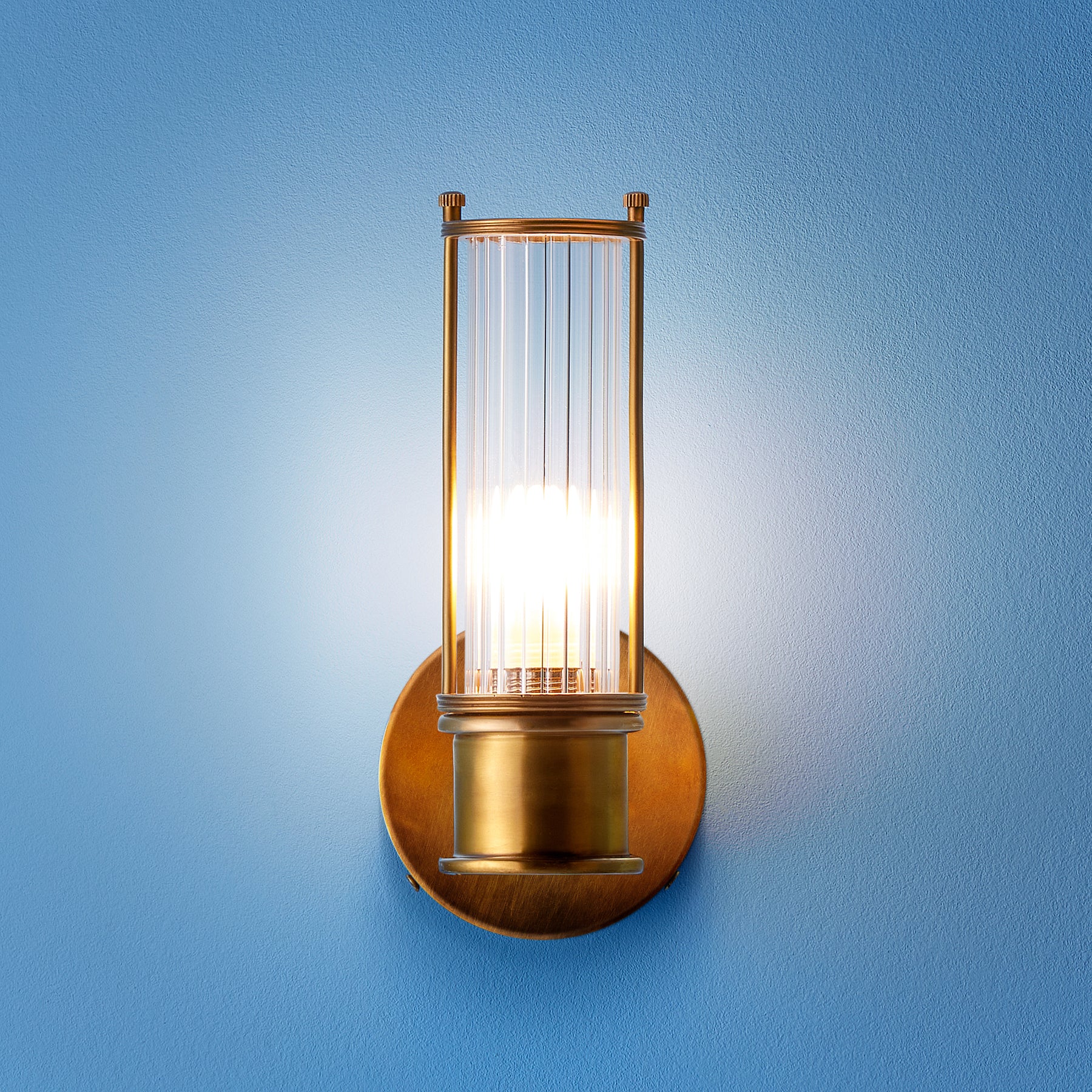 Smaller Hunter wall sconce in antiqued brass and glass - Image 4