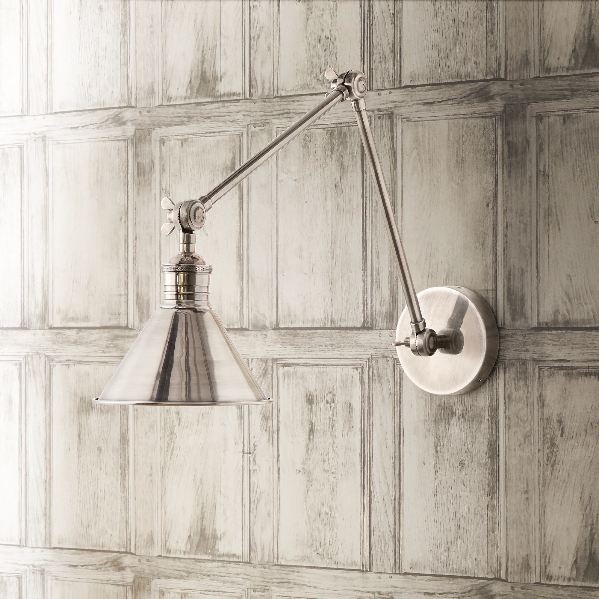 Stork wall sconce in antiqued silver